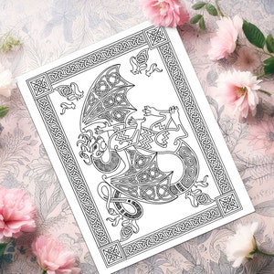 May include: A black and white printable coloring page featuring a detailed Celtic knotwork dragon design. The dragon is curled up with its wings spread out. The design is framed by a border of Celtic knots.