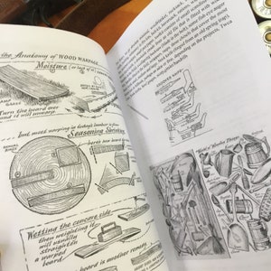 May include: A black and white illustration of a crooked knife with a wooden handle. The illustration is from a book about woodworking and includes text about the anatomy of wood warpage and seasoning shrinkage.