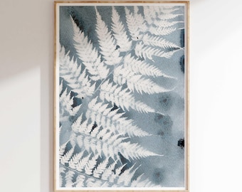 May include: A watercolor print of a fern frond in shades of blue and white. The fern is depicted in a realistic style, with intricate details of the leaves and stems. The background is a soft blue watercolor wash.