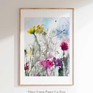 May include: Watercolor painting of a field of wildflowers in shades of pink, yellow, and green. The painting has a soft, dreamy feel and is perfect for adding a touch of nature to any room.