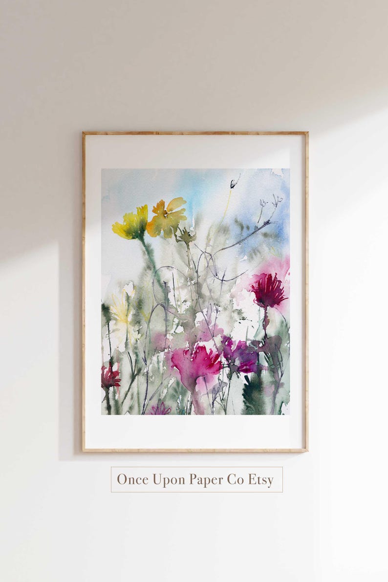 May include: Watercolor painting of a field of wildflowers in shades of pink, yellow, and green. The painting has a soft, dreamy feel and is perfect for adding a touch of nature to any room.