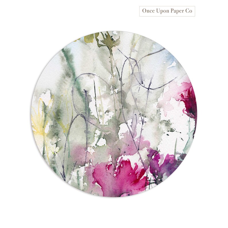 May include: A watercolor painting of pink and purple flowers with green stems and leaves on a white background. The painting is in a circular frame.