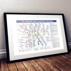 May include: A black and white map of the London Underground, titled "The Queens Park Rangers Tube Map". The map shows the different lines and stations of the London Underground.
