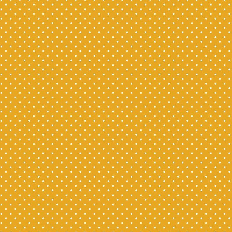 May include: A yellow background with a white polka dot pattern.
