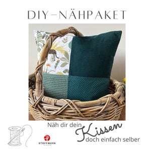 May include: DIY sewing kit for a green and white patterned pillow with the text "Näh dir dein Kissen doch einfach selber" (Sew your own pillow, just do it yourself).