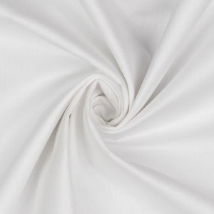 May include: White fabric with a smooth texture, folded and twisted into a spiral shape.