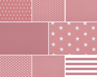 May include: A collection of nine pink fabric swatches with different patterns, including anchors, stars, polka dots, stripes, and a solid pink swatch.