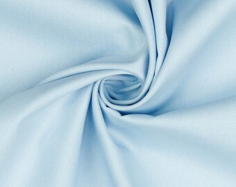 Peut inclure: Un gros plan sur un tissu bleu clair avec une texture lisse. Le tissu est plié et tordu, créant un motif en spirale.
