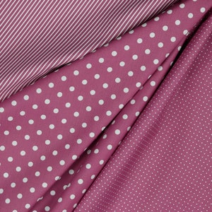 May include: Three fabric swatches in different patterns: pink with white stripes, pink with large white polka dots, and pink with small white polka dots.