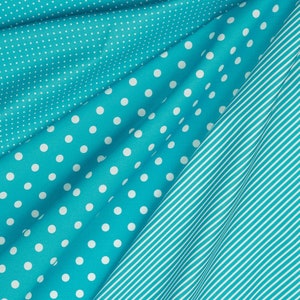 May include: A close-up of three fabric swatches in different patterns. The top swatch is a small white polka dot pattern on a turquoise blue background. The middle swatch is a larger white polka dot pattern on a turquoise blue background. The bottom swatch is a white stripe pattern on a turquoise blue background.