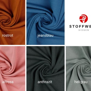 Puede incluir: Seis muestras de tela en diferentes colores: &oacute;xido, azul claro, rosa, gris oscuro, gris claro. Las muestras est&aacute;n dispuestas en dos filas de tres. El texto "Stoffwerk Siegen" es visible en la esquina superior derecha.