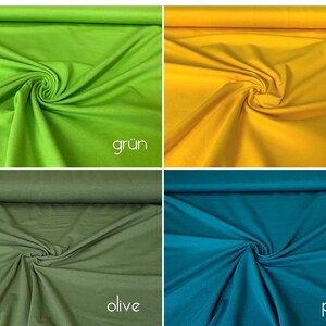 Puede incluir: Cuatro muestras de tela en diferentes colores: verde, amarillo, verde oliva y azul petr&oacute;leo. Las muestras est&aacute;n dispuestas en una cuadr&iacute;cula y todas est&aacute;n dobladas de la misma manera. Las palabras "gr&uuml;n", "gelb", "olive" y "petrol" est&aacute;n escritas debajo de cada muestra.