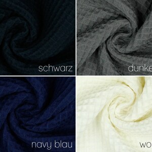 May include: Four fabric swatches in different colors: black, dark gray, navy blue, and off-white. The fabric has a waffle texture.