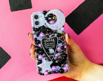 Funda para teléfono decodificada ouija planchette negra y lila