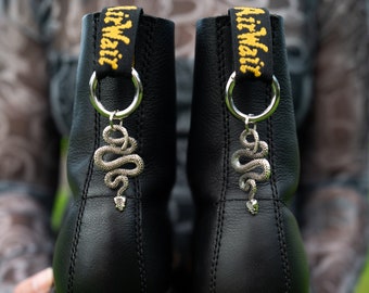 Amuletos de serpiente para botas