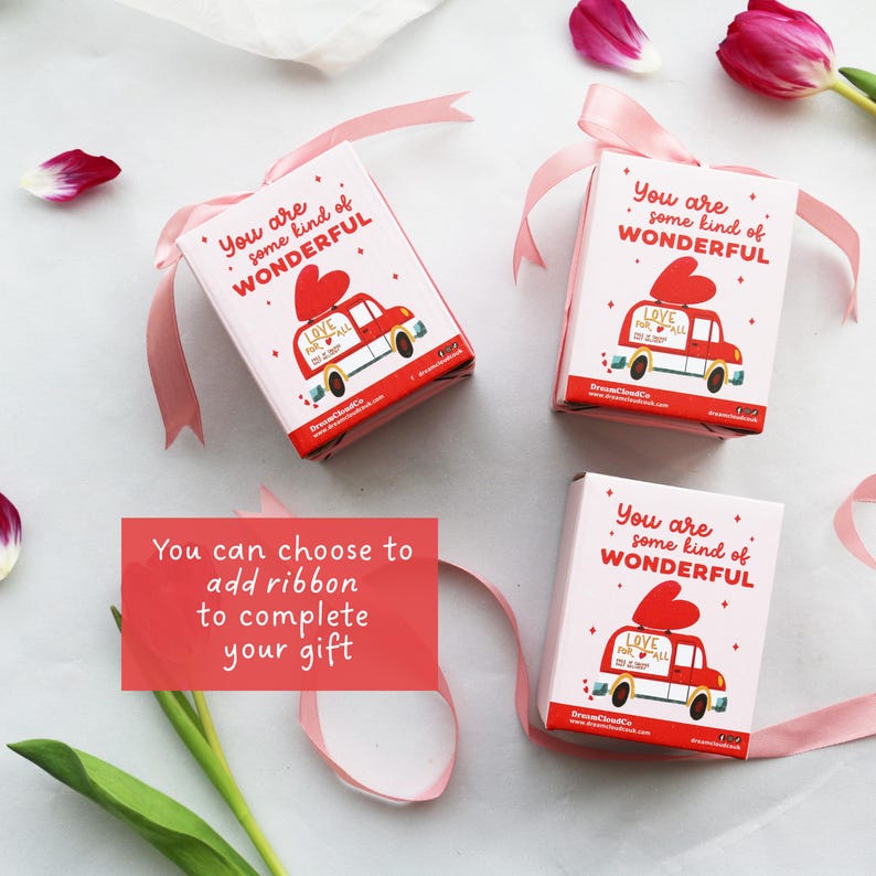 May include: Three gift boxes with a red car graphic and the text "You are some kind of WONDERFUL" and "LOVE for all". Each box is tied with a pink ribbon. The image also includes text that says "You can choose to add ribbon to complete your gift".