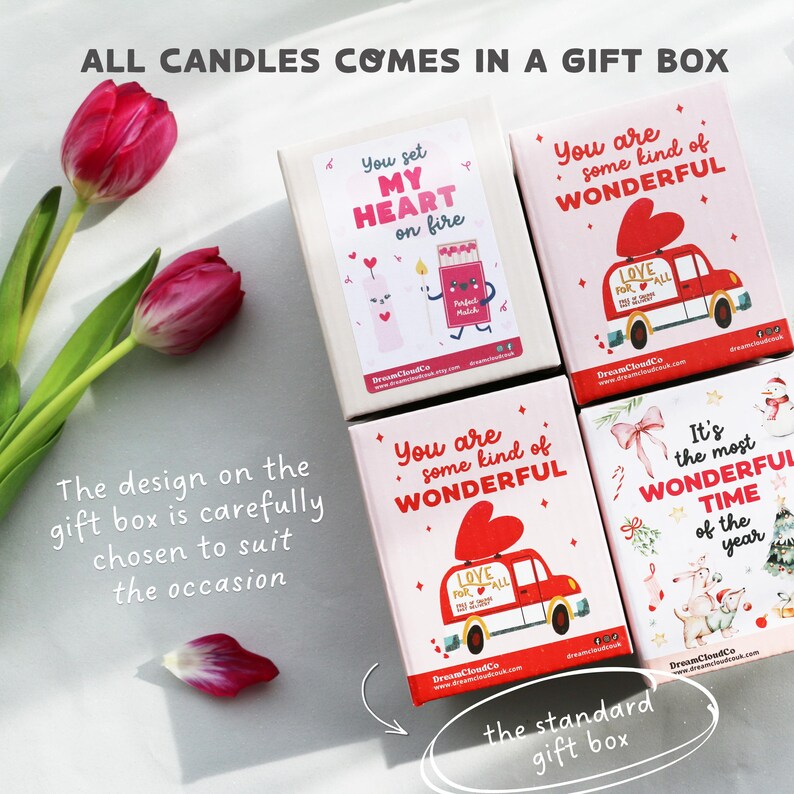 May include: A collection of gift boxes with various designs and text, including "You set MY HEART on fire" and "You are some kind of WONDERFUL." The boxes feature illustrations of a car with a heart and a candle. The text "ALL CANDLES COMES IN A GIFT BOX" is at the top.