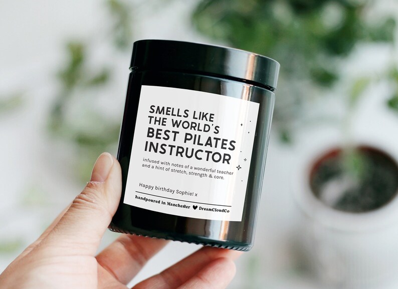 Birthday Gift For Pilates Instructor: Personalised Candle that reads 'smells like the world's best pilates instructor'. Thank you gift for pilates instructor.