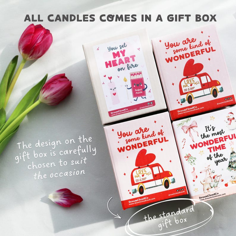 May include: A collection of gift boxes with various designs. One box reads "You set my heart on fire" with candle and match illustrations. Other boxes say "You are some kind of wonderful" with a car and heart design.