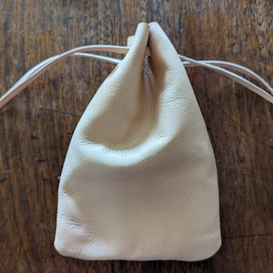 Undyed, tan goatskin drawstring pouch.