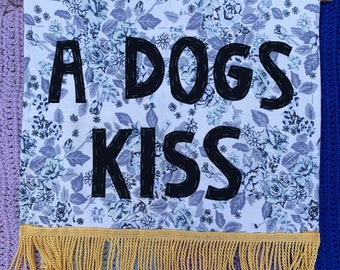 A Dogs Kiss banner