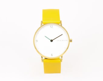 Women's gold watch in yellow leather and white dial