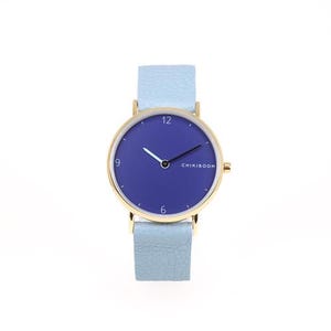 Montre femme OR en cuir bleu pâle et cadran marine