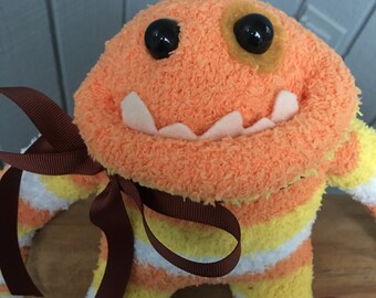 Fuzzy sock monster ,sock monster ,long arms and legs sock monster