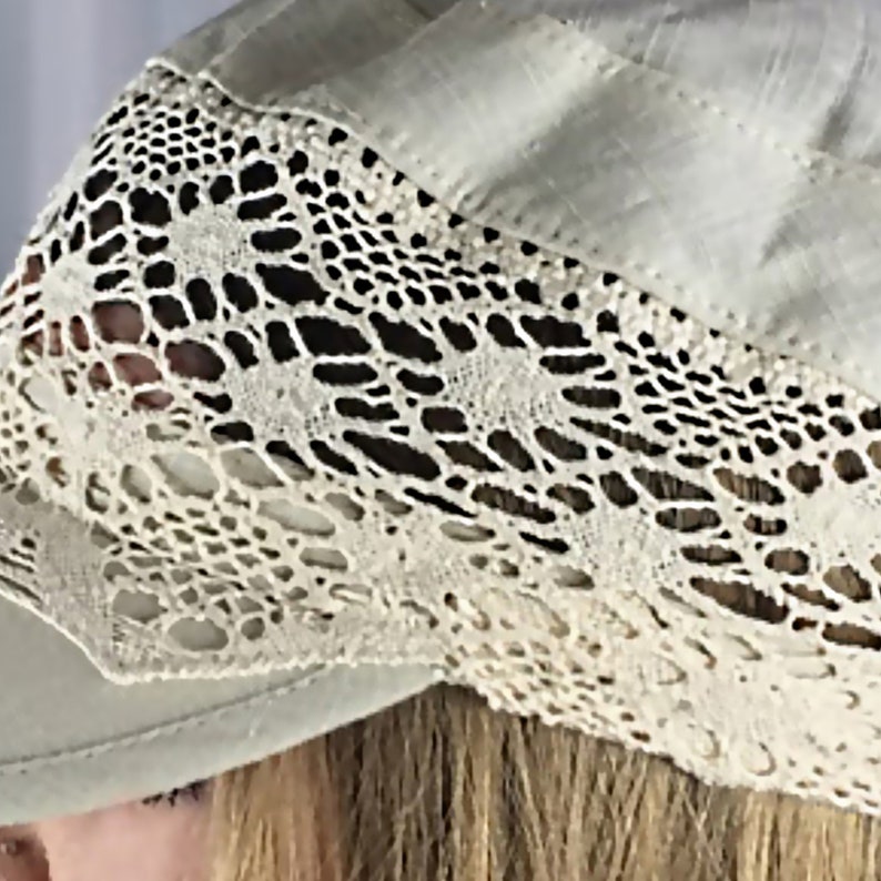 macro shot of the intricate floral lace and premium linen fabric, showcasing the high-quality craftsmanship of this summer headpiece.
