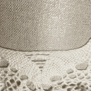 extreme close-up of the delicate lace textures and breathable linen weave used in this lightweight pastel headwear.