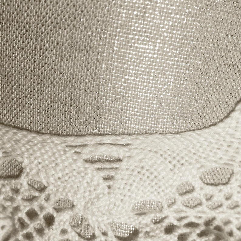 extreme close-up of the delicate lace textures and breathable linen weave used in this lightweight pastel headwear.