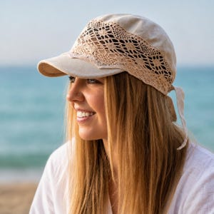 profile view of a lady wearing a delicate lace baseball cap for women, highlighting the elegant floral patterns and airy texture.
