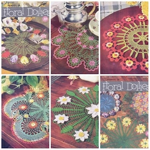 May include: A collection of six crochet doilies with floral designs. The doilies are made in various colors, including green, pink, red, yellow, and white. The doilies are displayed on a wooden table. The image is from a vintage book titled "Floral Doilies".