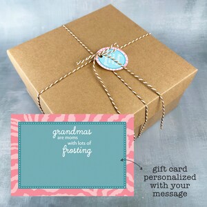 May include: A brown gift box tied with twine and a pink and blue gift tag that says "Grandmas are moms with lots of frosting". A pink and blue gift card with a zebra print border says "gift card personalized with your message".