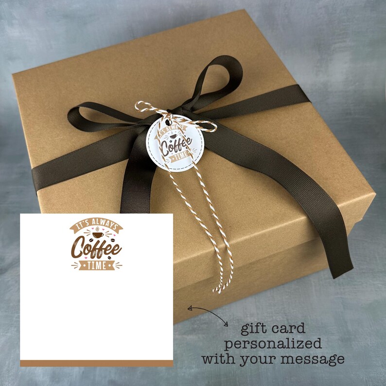 May include: A brown gift box with a black ribbon and a gift tag that says "It's Always Coffee Time". The box is tied with twine and a gift card is included.