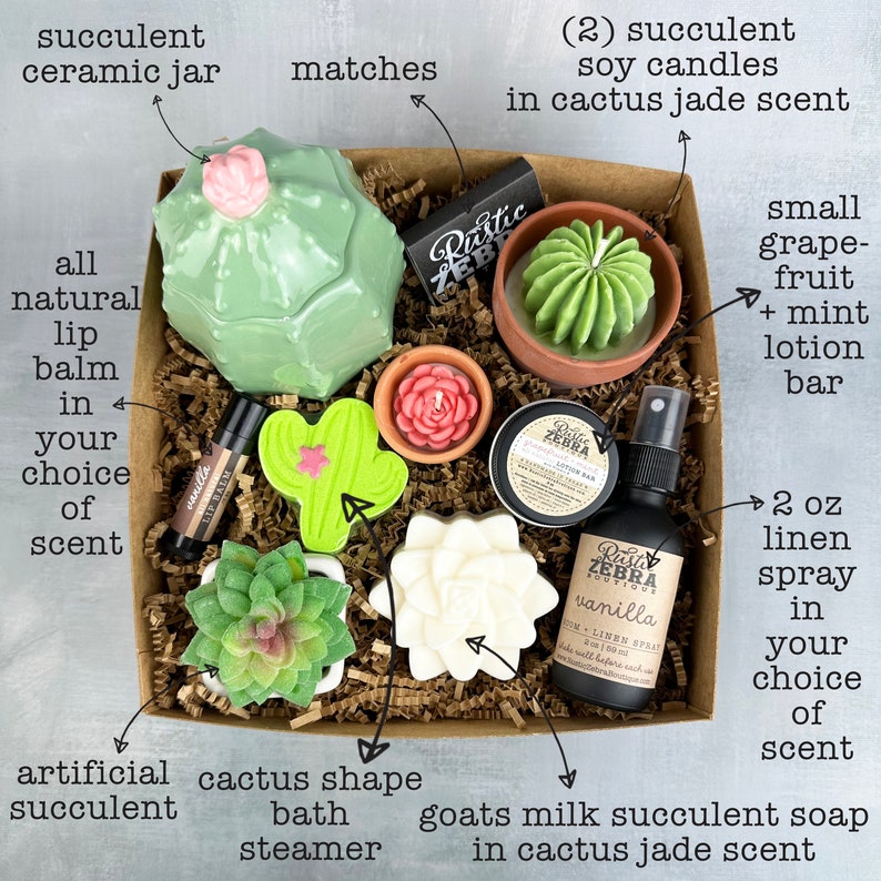 May include: A gift box filled with succulent-themed items. Includes a ceramic jar, soy candles, a lotion bar, linen spray, lip balm, a bath steamer, and soap. The box contains decorative matches and an artificial succulent.