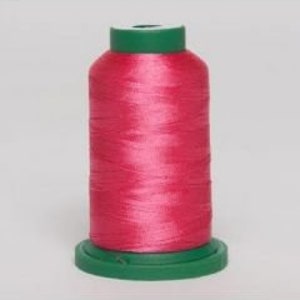 May include: A spool of bright pink embroidery thread with a green base and top. The thread is tightly wound, showing a smooth, shiny texture. The spool is centered against a plain background.