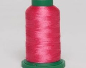 May include: A spool of bright pink embroidery thread with a green base and top. The thread is tightly wound, showing a smooth, shiny texture. The spool is centered against a plain background.