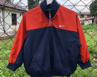 Chaqueta cortavientos Nike vintage de los años 90 con media cremallera y logotipo bordado