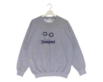 Sudadera vintage de Disneyland Resort con bordado de hechizos y cuello redondo