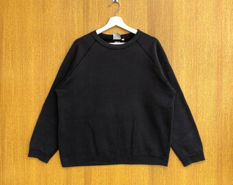 Sudadera Avirex vintage lisa con estampado USA y cuello redondo.