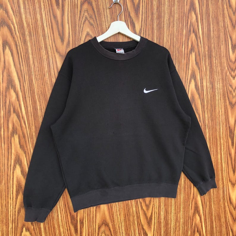 May include: A set of three ceramic mugs with a speckled, matte finish. The mugs are in shades of cream, light gray, and dark gray. Each mug has a simple, minimalist design, perfect for coffee or tea.