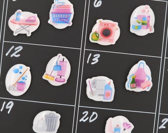 May include: A black calendar with white numbers and the word "FRIDAY" at the top. The calendar features various cleaning-themed stickers, including a washing machine, mop, and cleaning supplies.