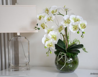 Artificial orchids in a glass bowl. Real touch orchid arrangement.