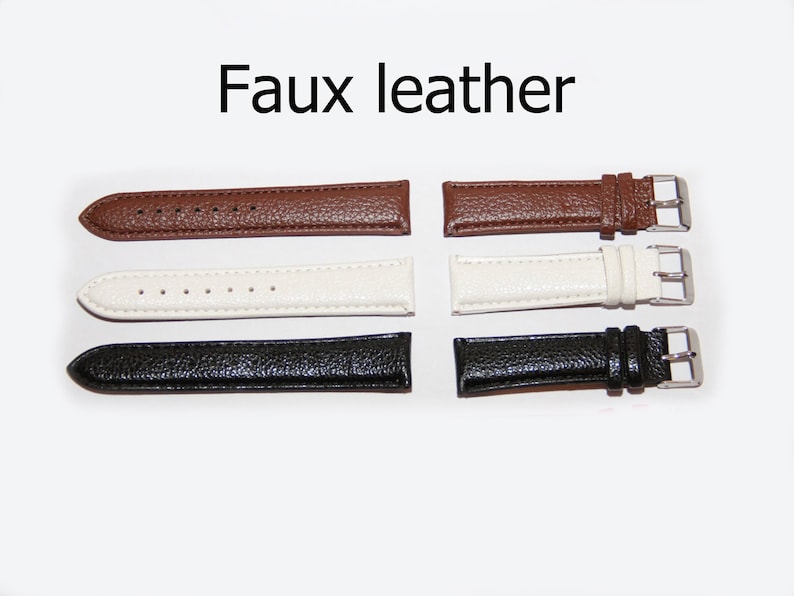 May include: Three faux leather watch straps in brown, white, and black. Each strap has a silver buckle.