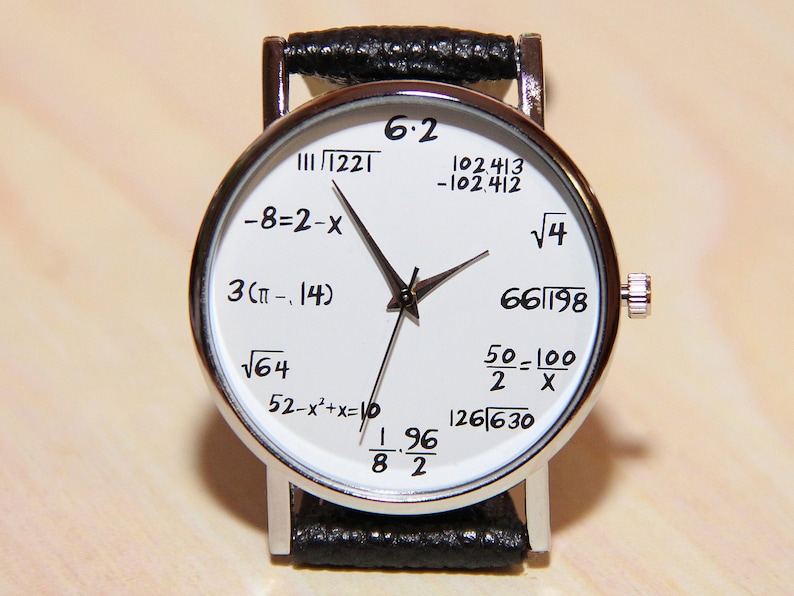 May include: A white wristwatch with a black leather band. The watch face features various mathematical equations, including 6.2, 11/1221, 102.413, -102.412, -8-2-x, 3(&pi;-.14), &radic;64, 52-x&sup2;+x=10, 196/82, &radic;4, 66/198, 50-100/2 X, and 126/630.
