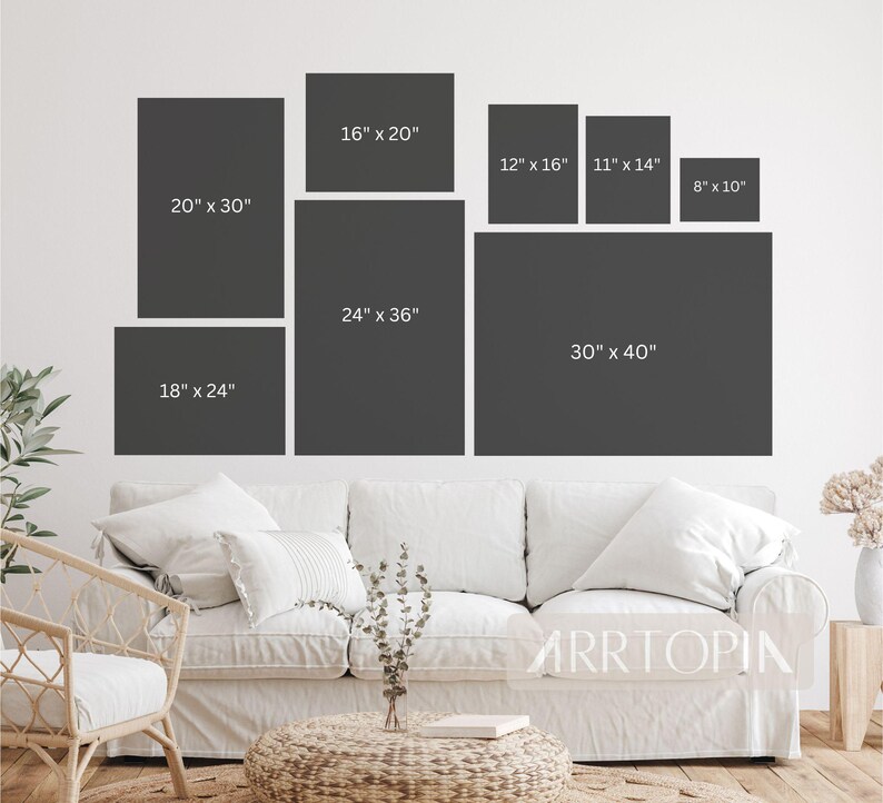 May include: A white wall with a variety of framed prints in different sizes. The prints are all black and white and have a modern minimalist aesthetic. The largest print is 30 inches by 40 inches, and the smallest print is 8 inches by 10 inches.