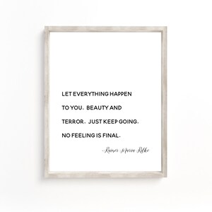 May include: A framed print with a white background and black text. The text reads: "Let everything happen to you. Beauty and terror. Just keep going. No feeling is final." The quote is attributed to Rainer Maria Rilke.