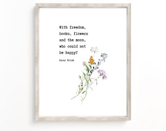 May include: A framed print with a white background and black text that reads "With freedom, books, flowers and the moon, who could not be happy? Oscar Wilde". The text is accompanied by a watercolor illustration of a bouquet of flowers.