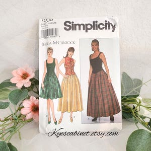 May include: Simplicity sewing pattern featuring Jessica McClintock designs. The pattern includes illustrations of three different dress styles. The package is white with black text and a barcode. The Etsy shop name, Kyescabinet.etsy.com, is printed at the bottom.